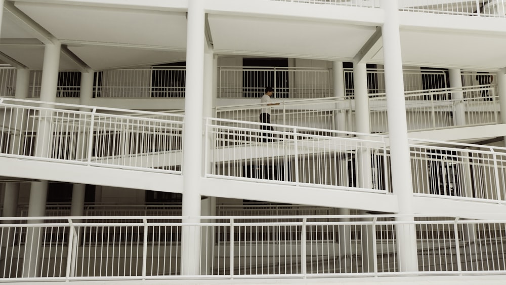 a man riding a skateboard down a metal hand rail