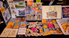 a table topped with lots of cards and pictures