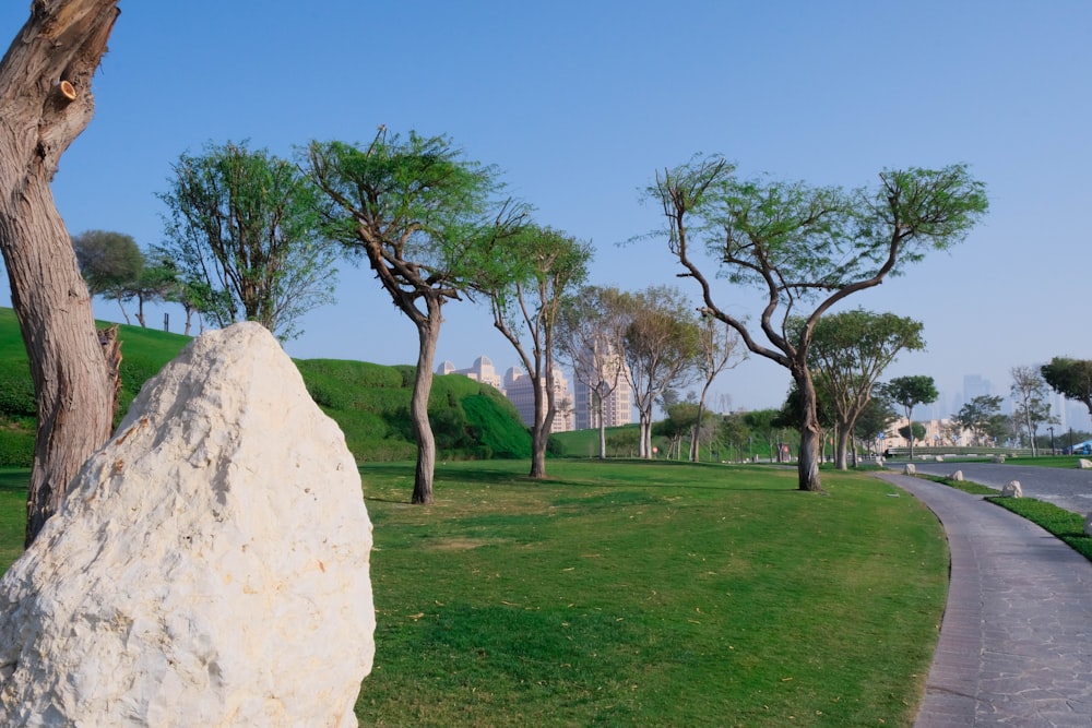 a large rock sitting on the side of a road