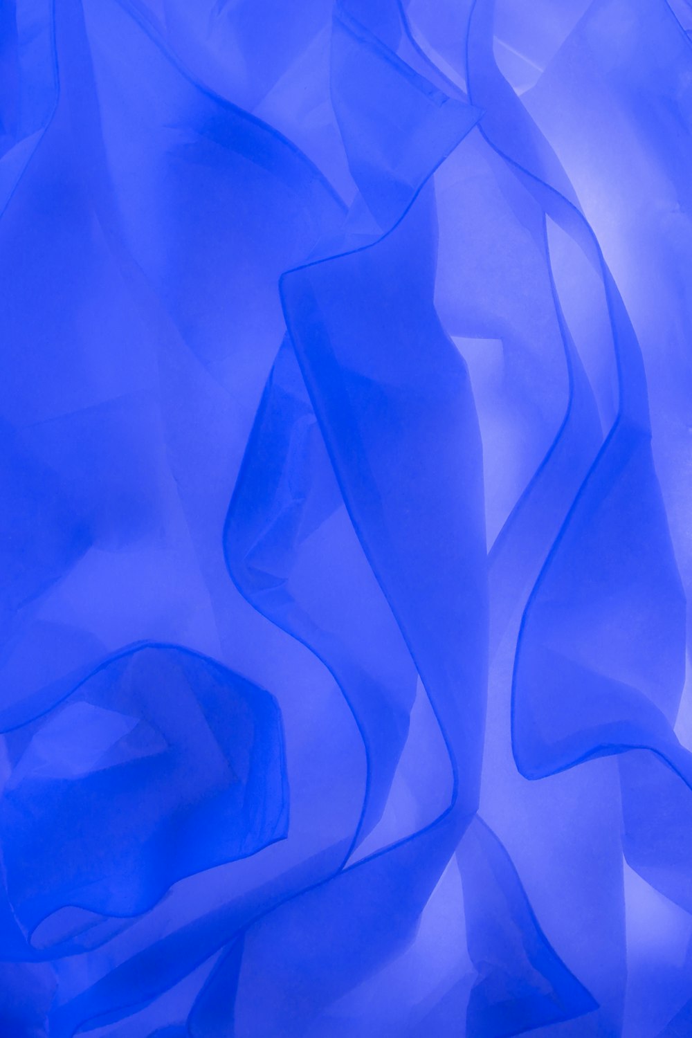 a close up of a blue sheer fabric