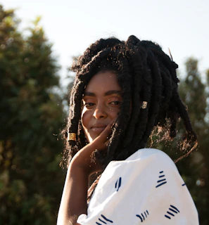 Elegant Senegalese twists cascading over shoulders in natural light