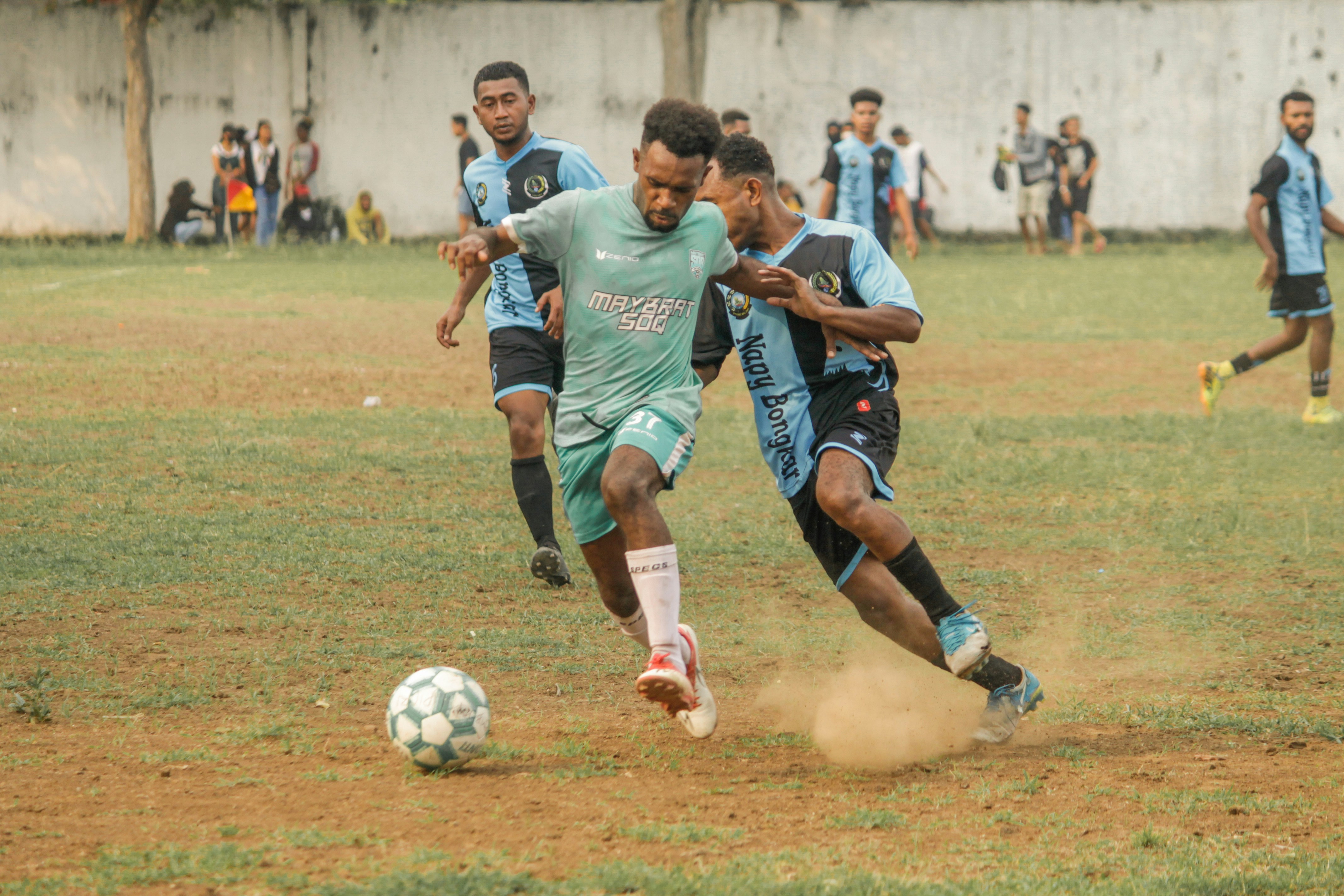 a group of young men playing a game of soccer