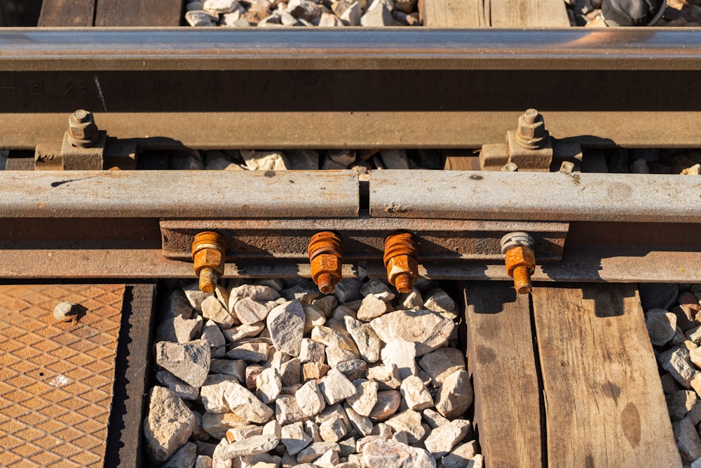 a close up of a train track with rocks