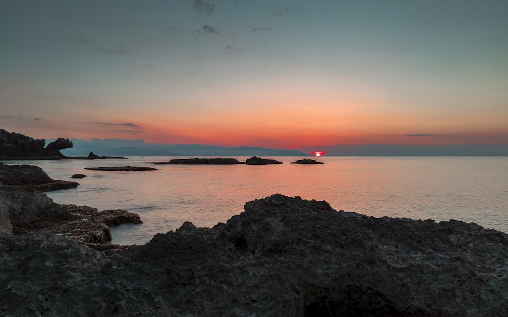 a sunset over a body of water