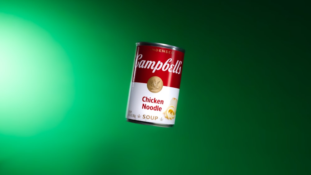 a can of rambulu chicken noodle soup on a green background