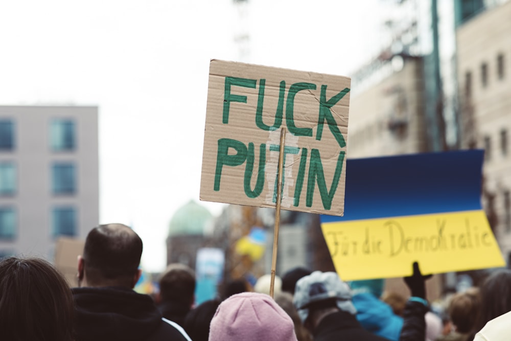 a group of people holding signs in the street