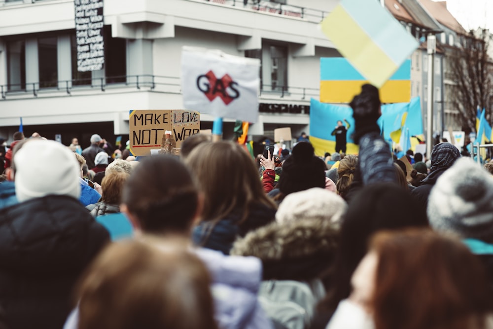 a crowd of people standing around a building