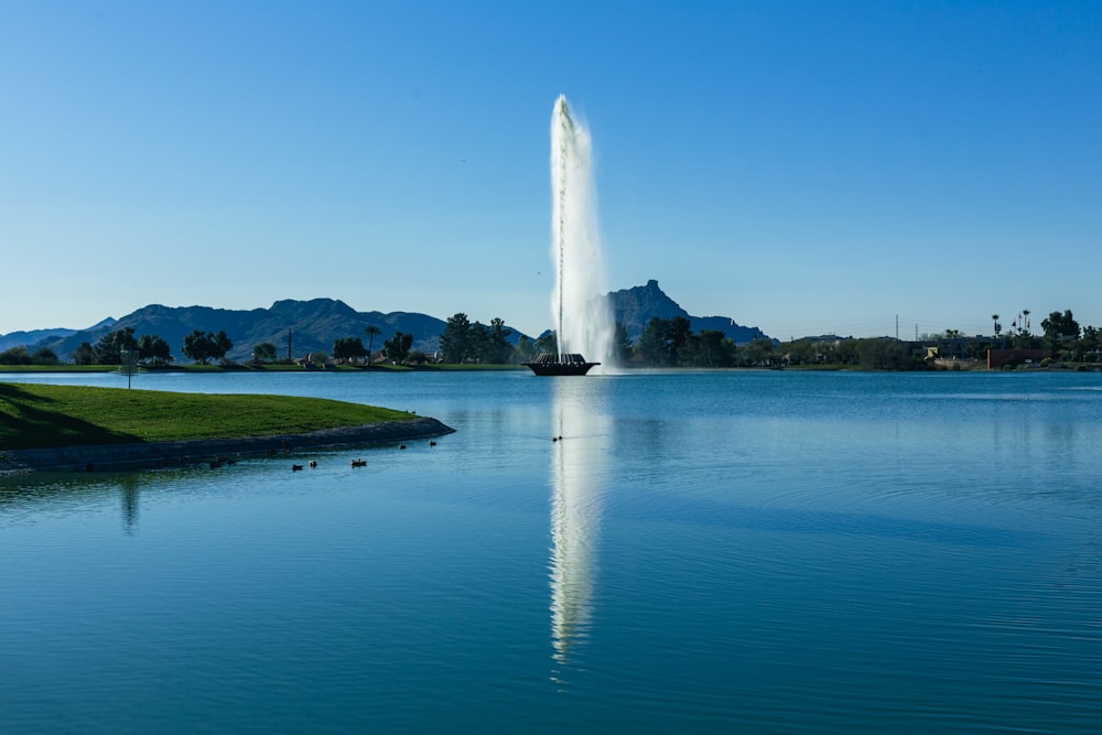 a large fountain spewing water into a lake
