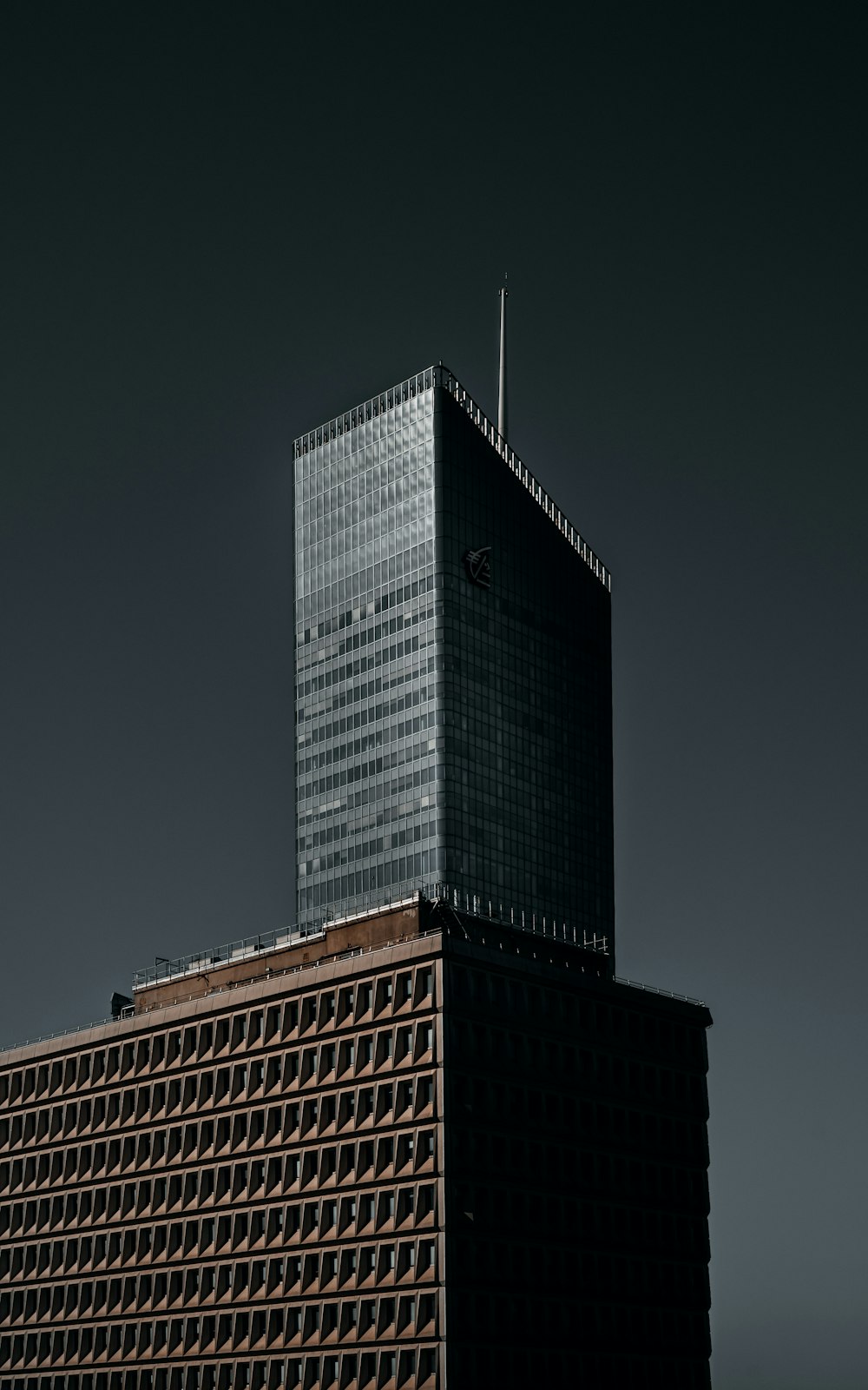 a very tall building with a sky background