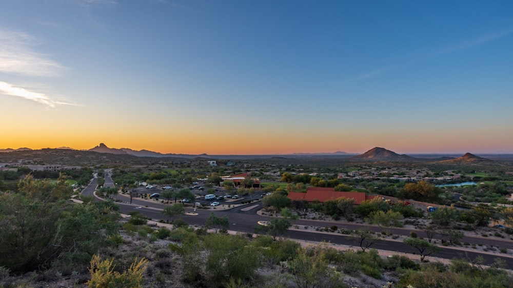 a scenic view of a town in the middle of the desert