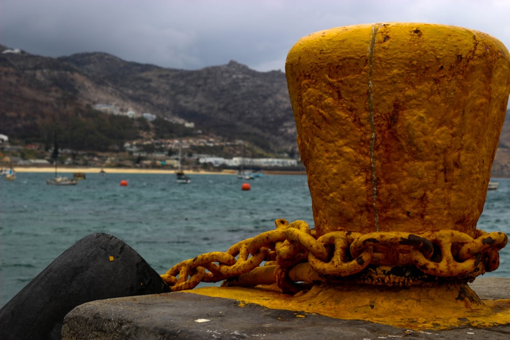 a chain is attached to a yellow object