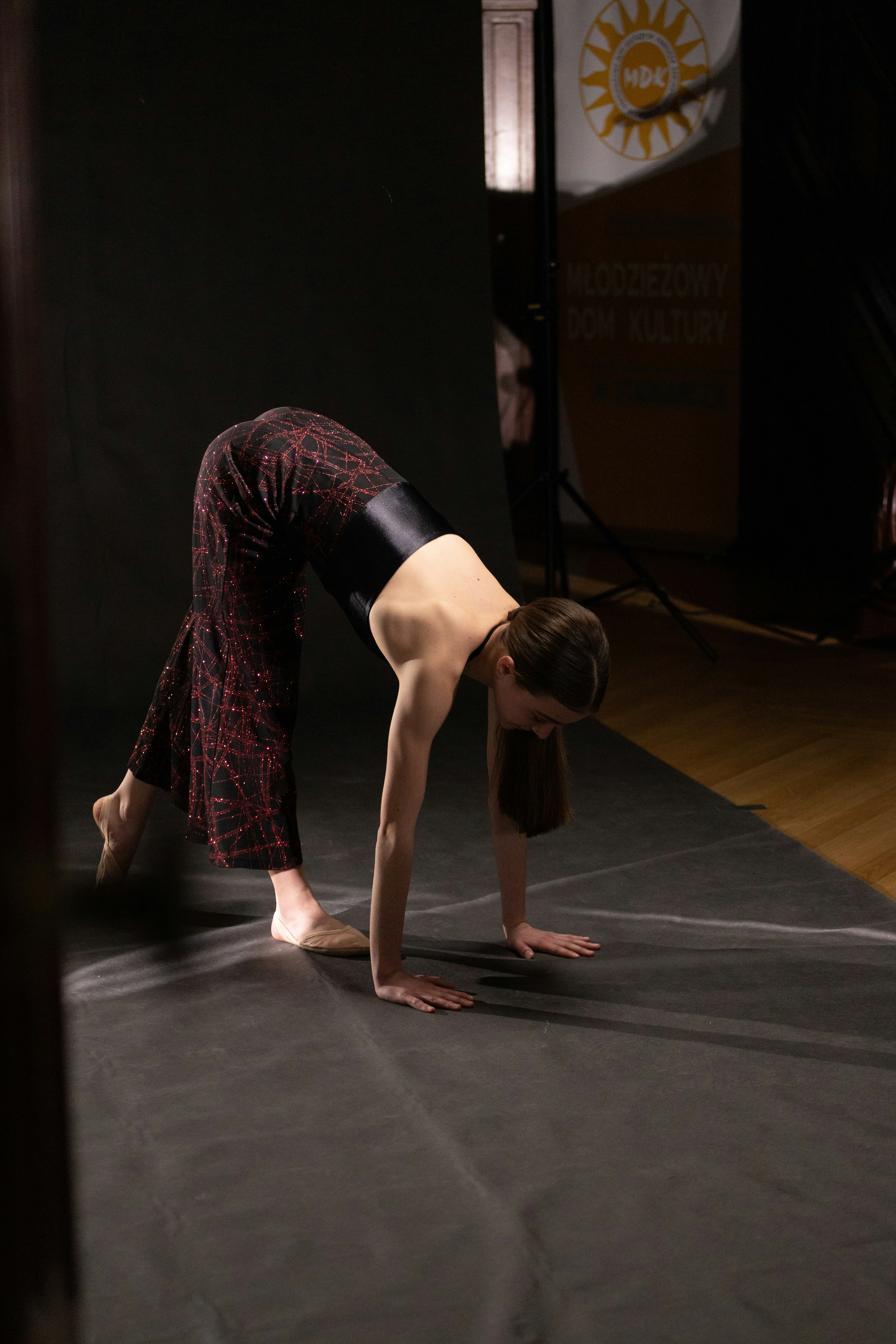 A woman is doing a handstand on the floor photo – Free Human Image on ...