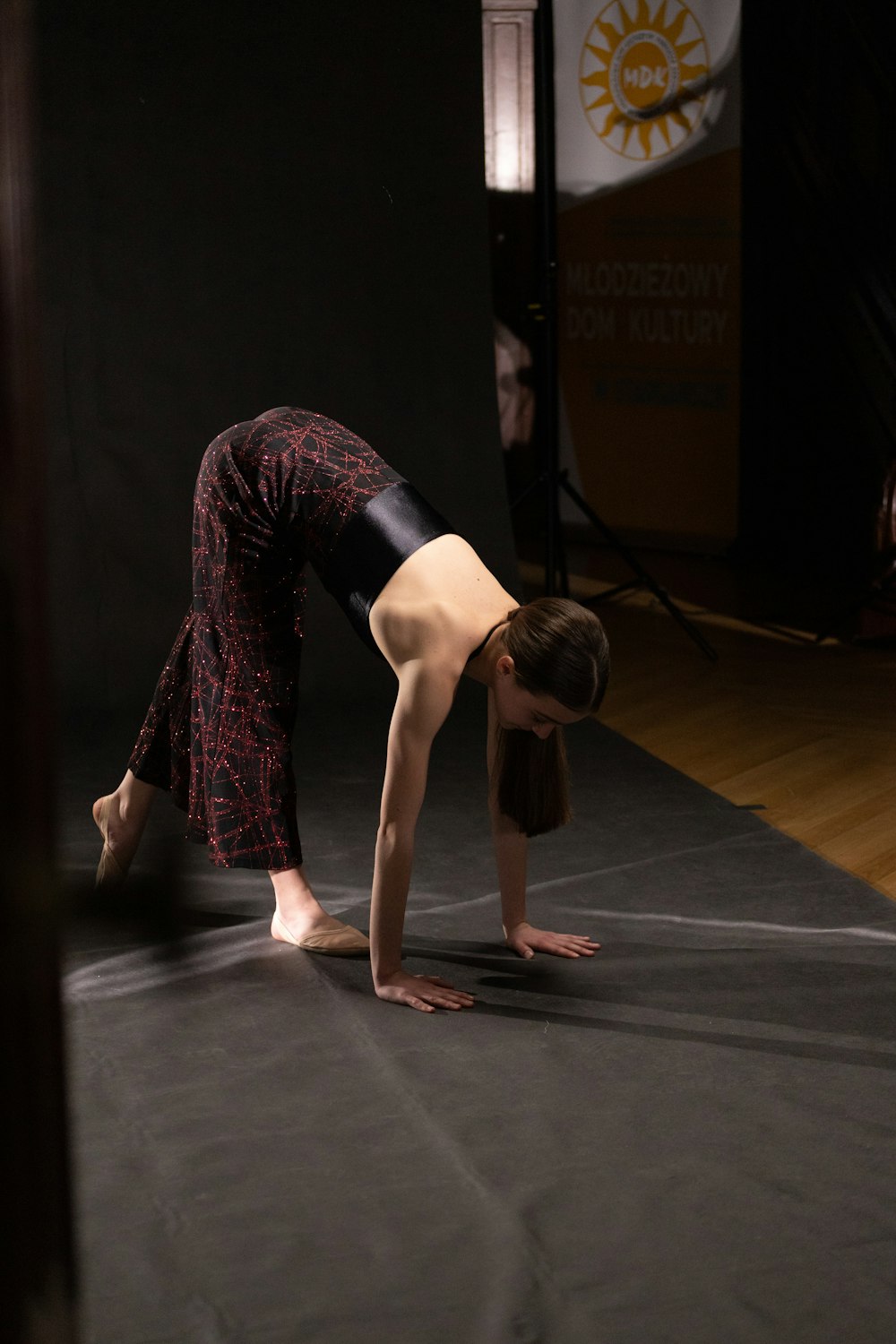 a woman is doing a handstand on the floor
