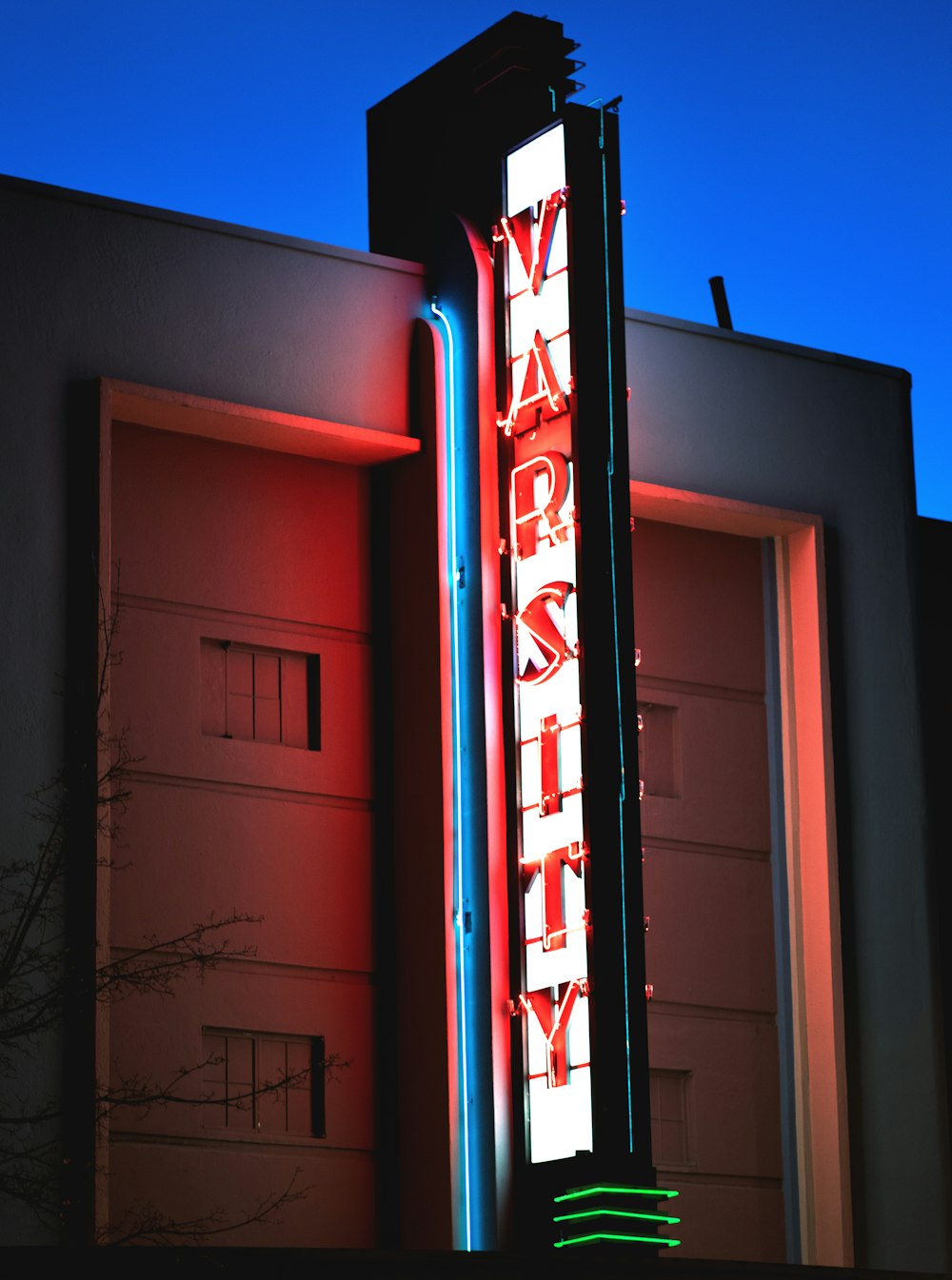 a neon sign on the side of a building