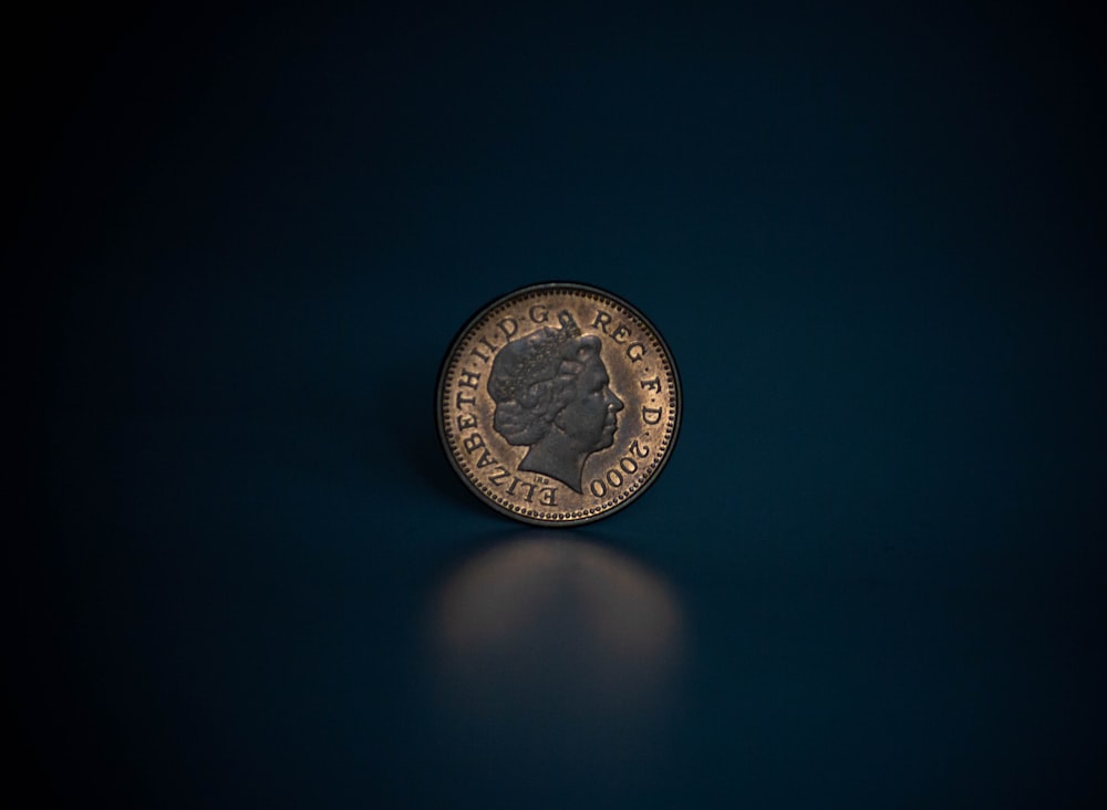 a close up of a coin on a table