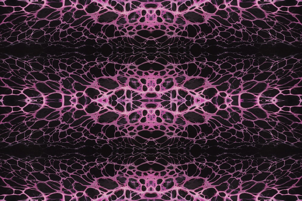 a black background with a pink pattern on it