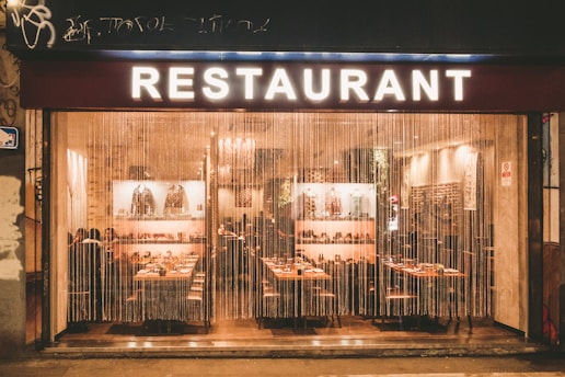 a restaurant that is lit up at night