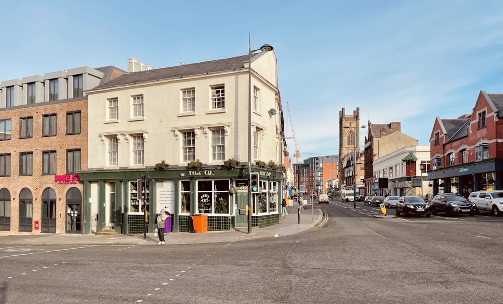 a street corner with cars parked on the side of it