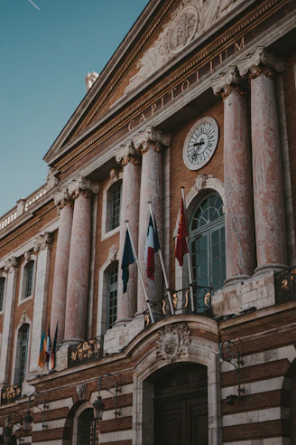a large building with a clock on the front of it