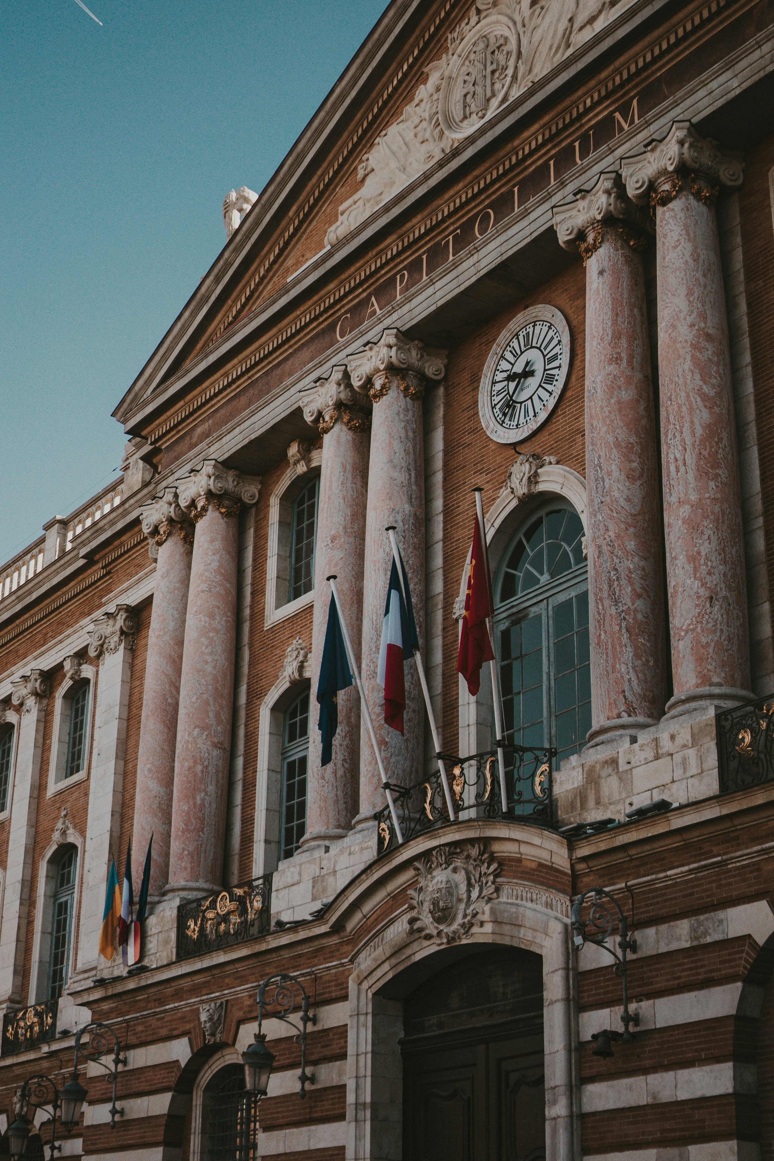 a large building with a clock on the front of it