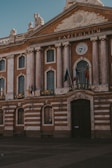a church with a clock on the side of a building
