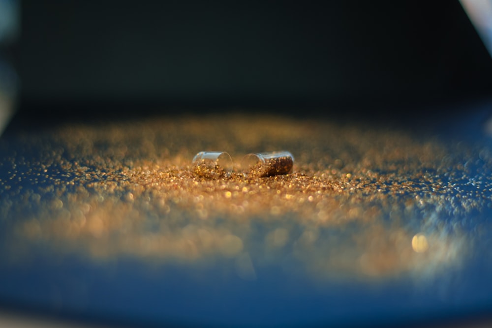 a close up of two pills on a table
