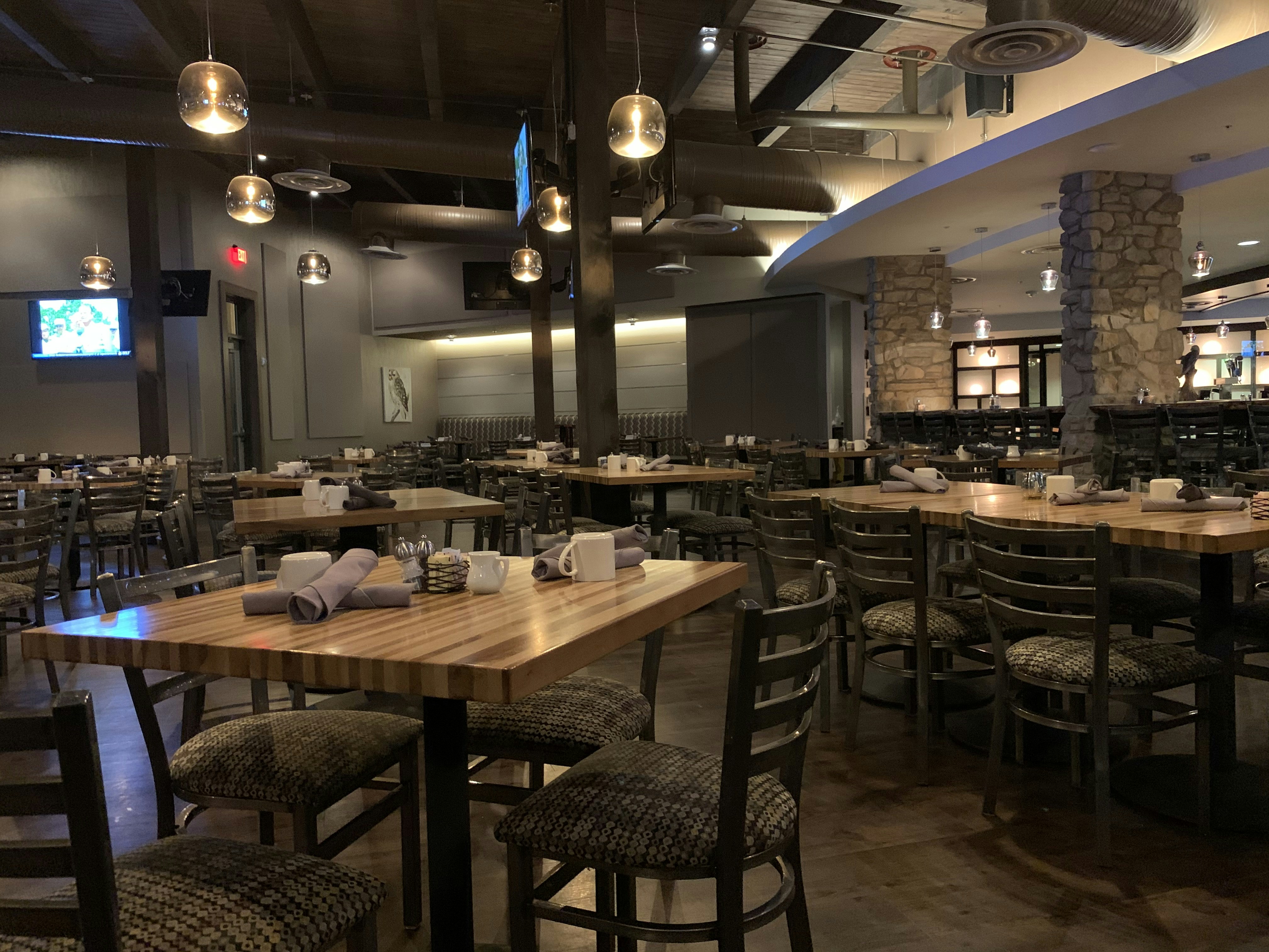 Restaurant branding materials with warm atmospheric dining environment