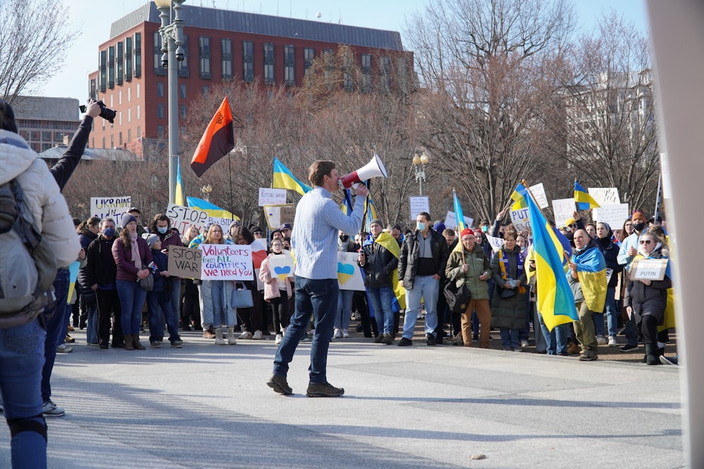 a group of people marching down a street