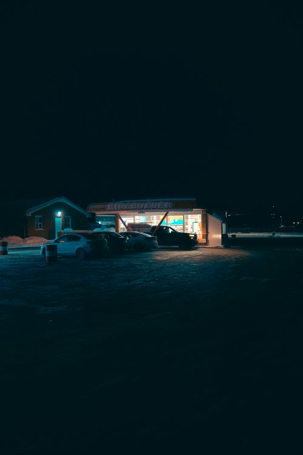 a car parked in front of a gas station at night