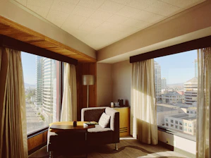 Cozy hotel room with a picturesque view outside the window.