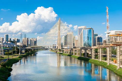 a river running through a city next to tall buildings