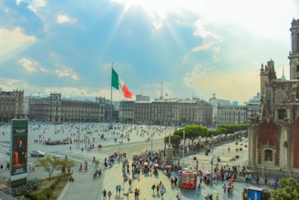 a large group of people walking around a city