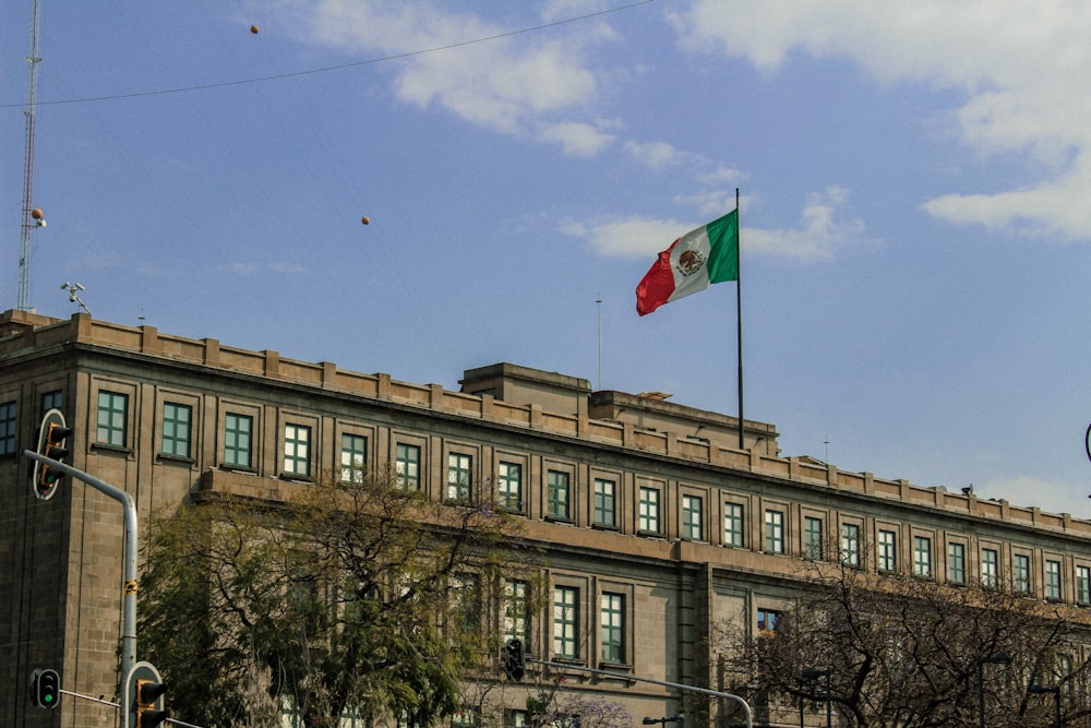 a large building with a flag on top of it