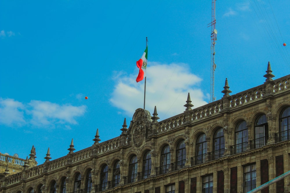 a large building with a flag on top of it