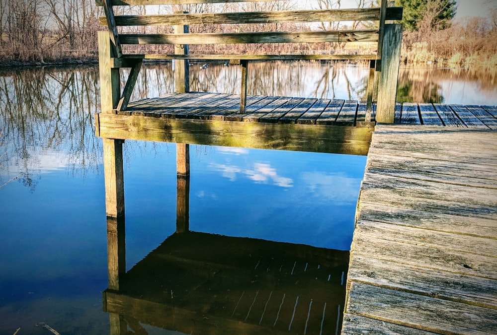 a wooden dock sitting on top of a body of water