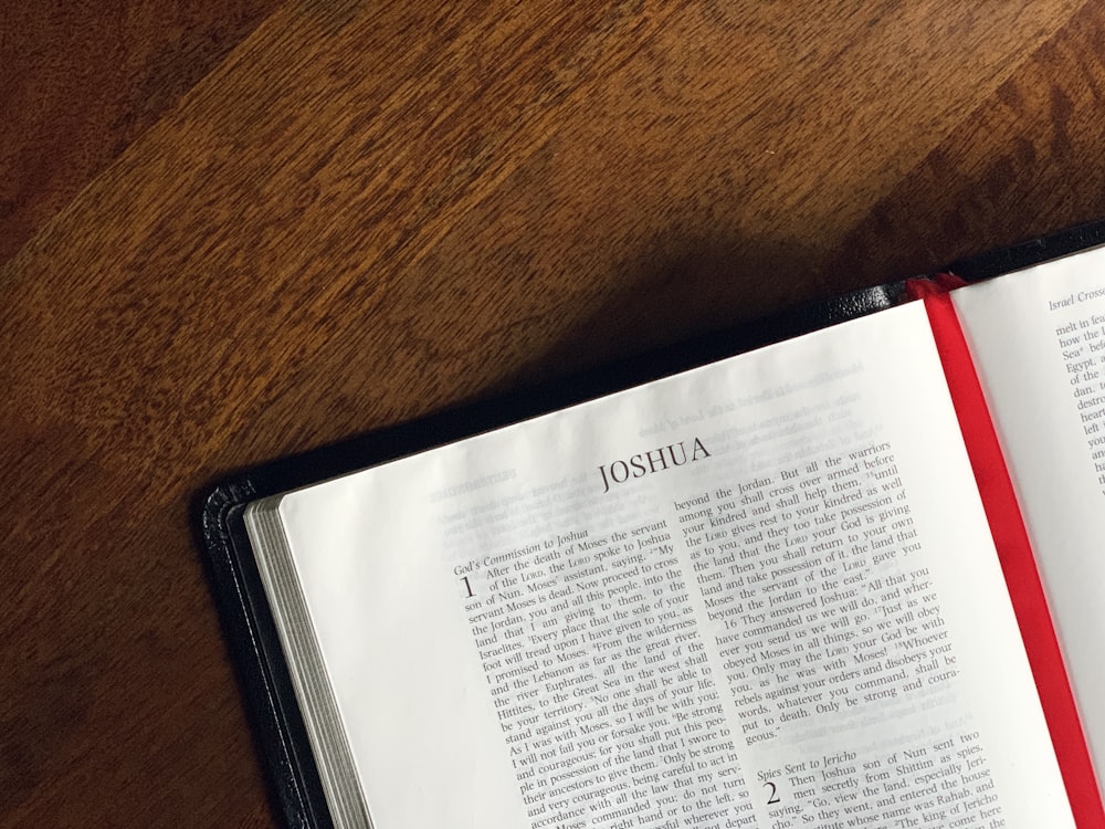 an open book on a wooden table