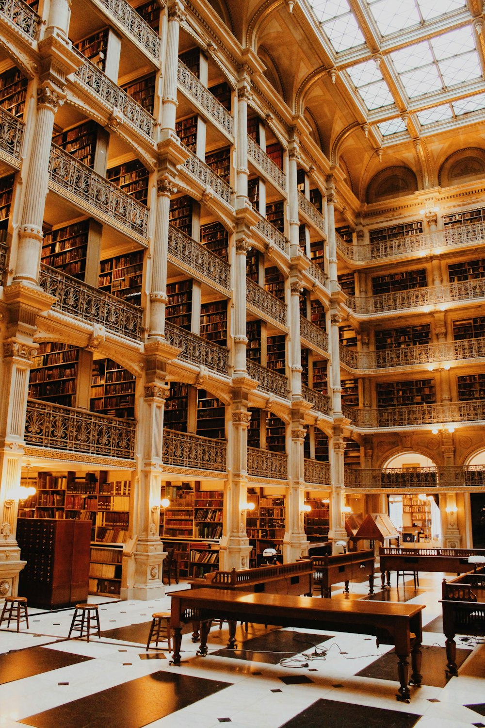 a library filled with lots of books and tables