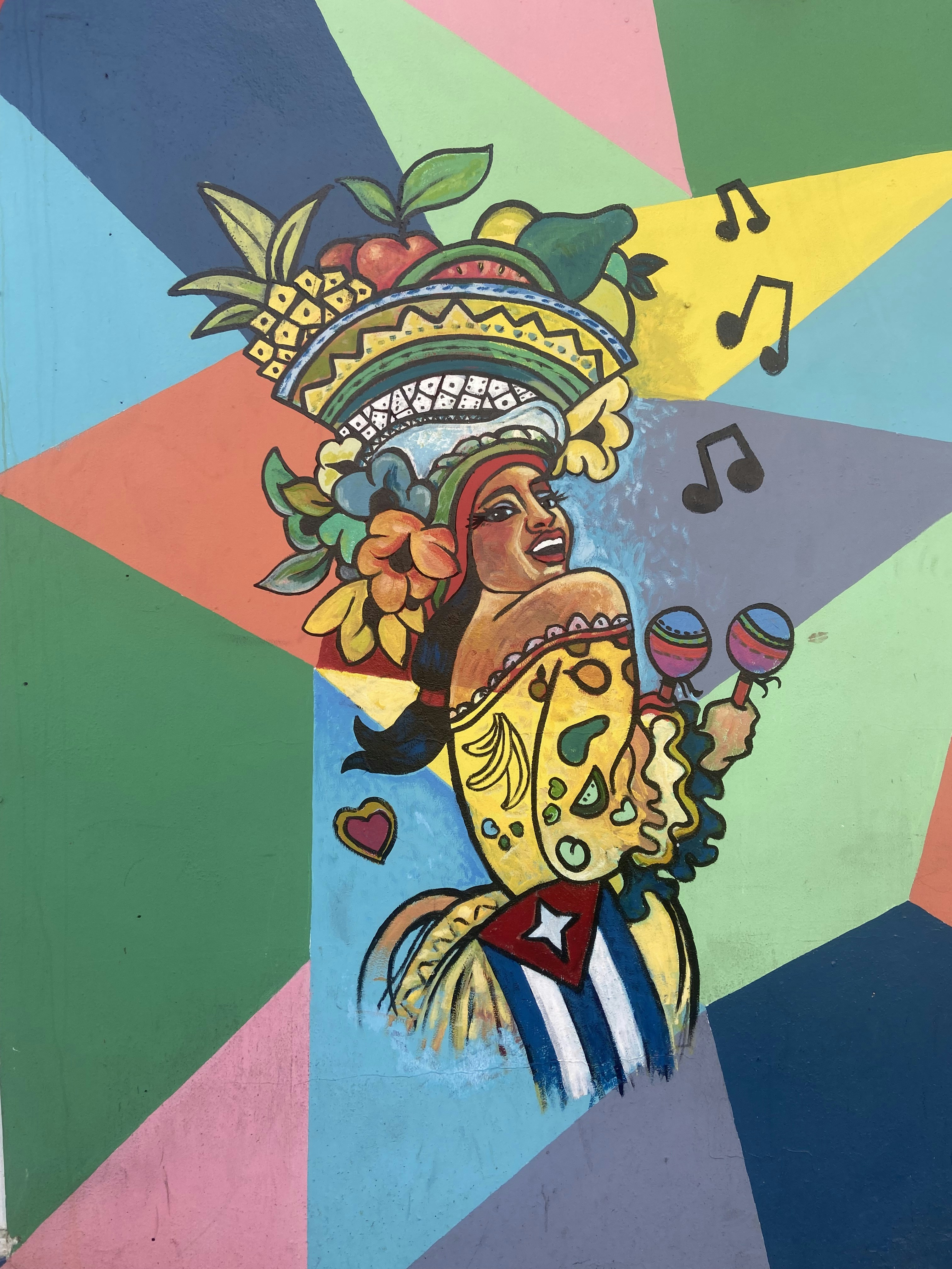 A colorful mural in Alicante depicting Latin American heritage and pride.