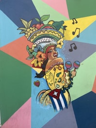 A colorful mural depicting a person with a vibrant fruit headdress and a traditional outfit holding maracas. The background features geometric shapes in various bright colors, and musical notes are illustrated to the side.
