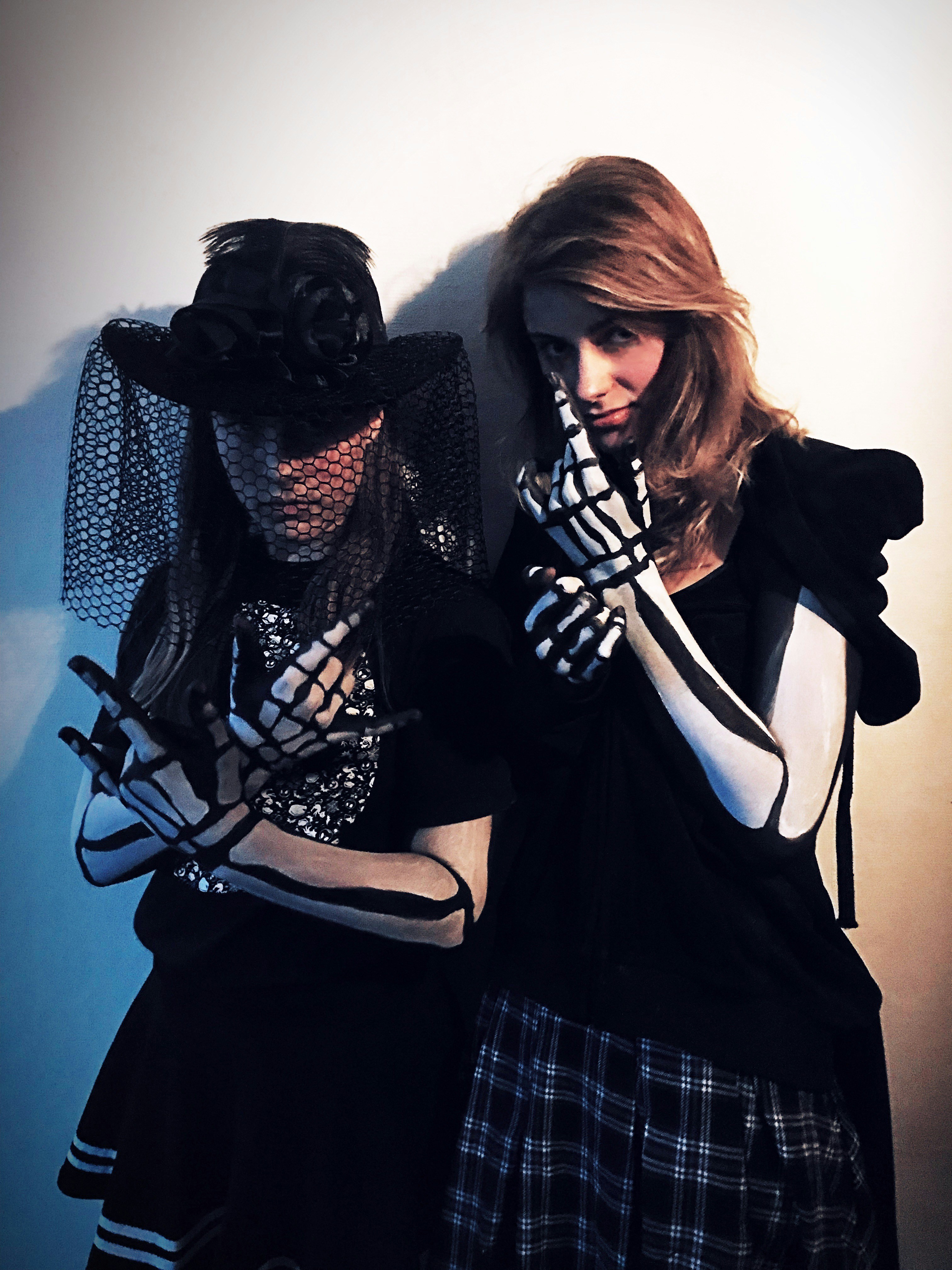 a couple of women standing next to each other