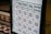 A pricing board for various types of massages, including Thai massage, foot massage, oil massage, and back-head-shoulder massage. Prices are listed for different time durations ranging from half an hour to two hours.