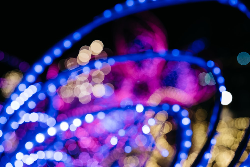 a blurry photo of a carnival ride at night