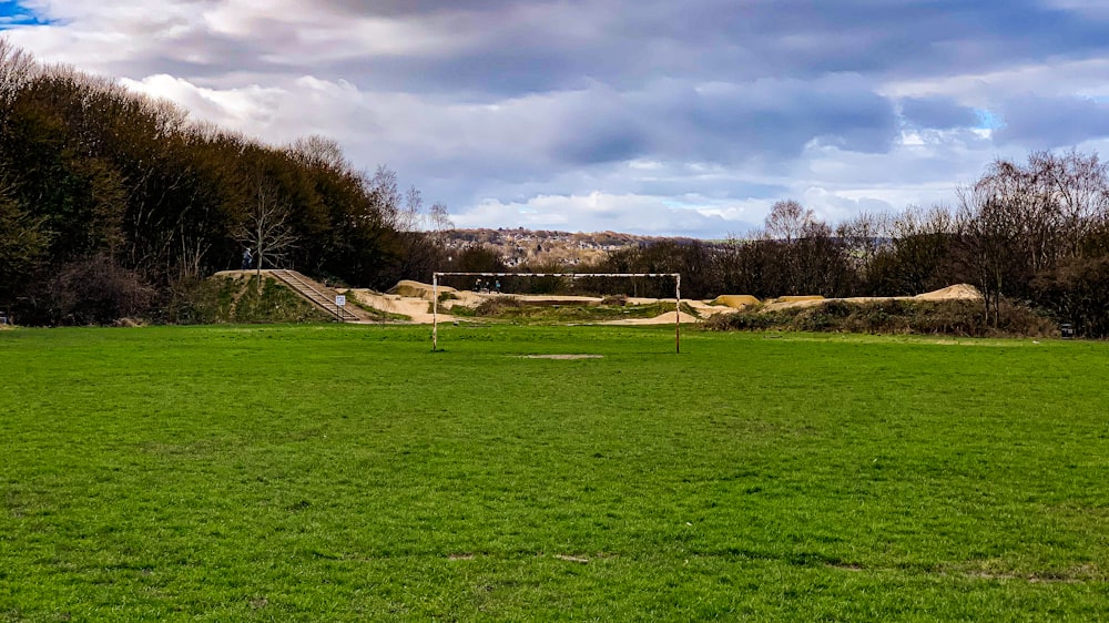 a soccer field with a soccer goal in the middle of it