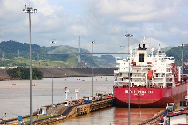 a large red and white boat docked at a dock