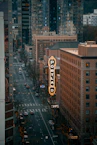 a city street filled with traffic and tall buildings