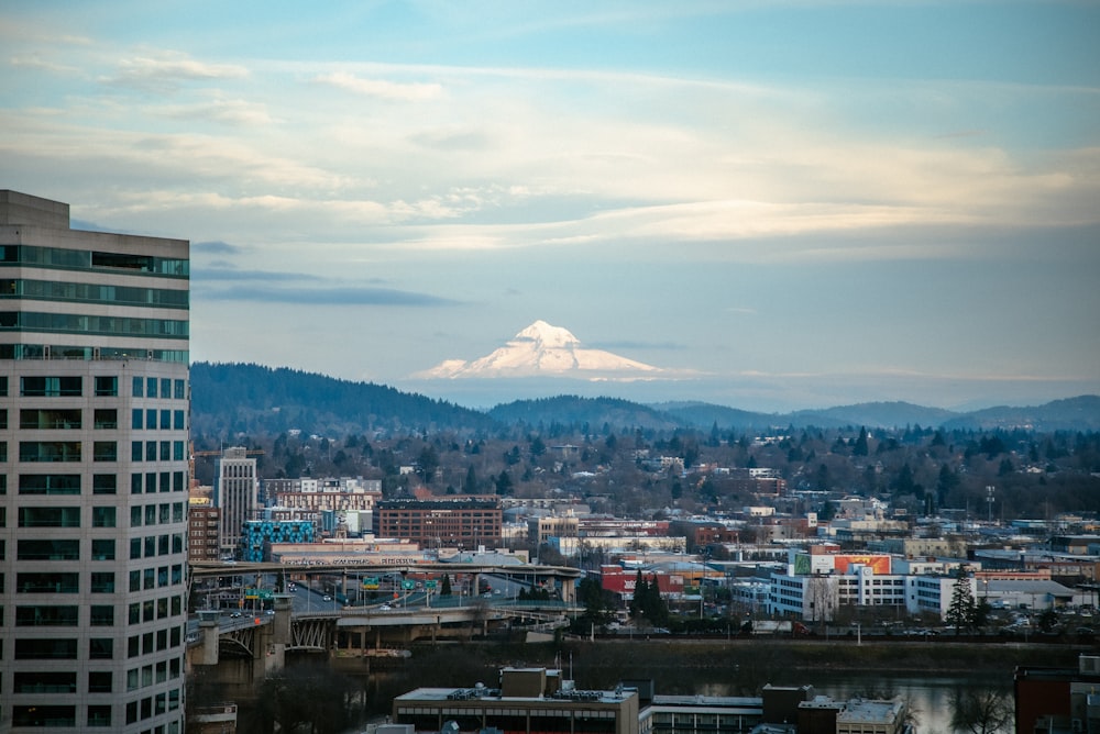 a view of a city with a mountain in the background