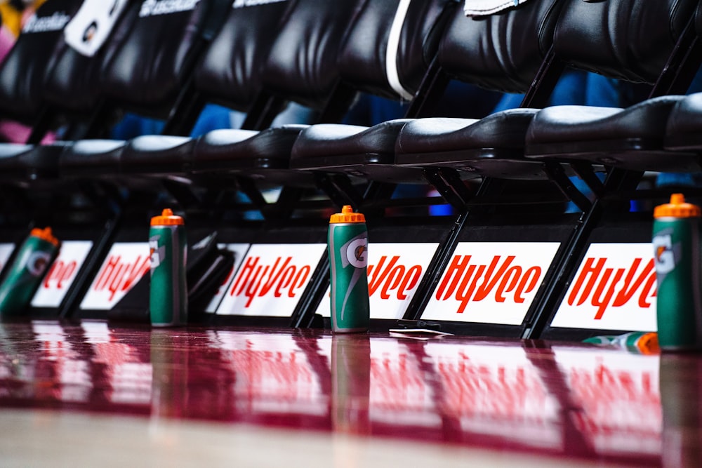 a row of black seats sitting next to each other