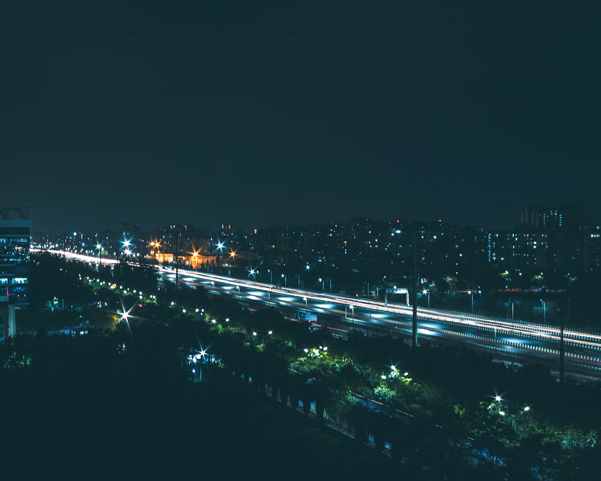Night view of Noida Electronic City highway and modern skyline
