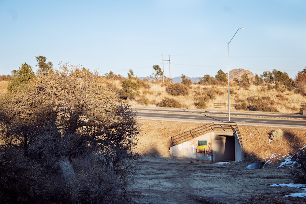 a dirt road with a tunnel on the side of it