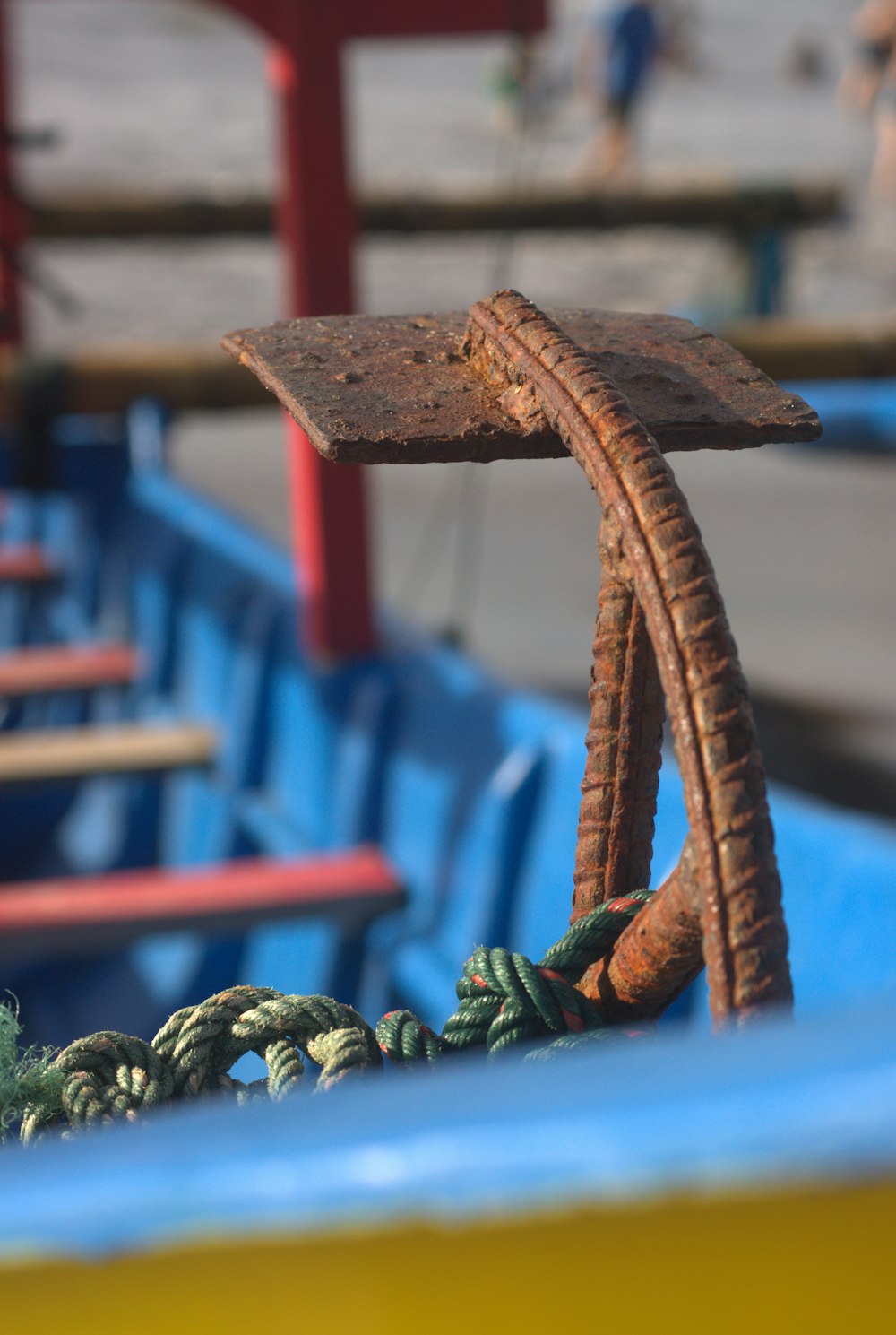 a close up of a blue boat with ropes on it